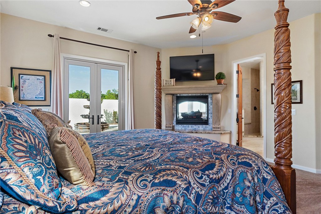 18205 Walnut Avenue Atascadero, CA 93422 - Photo 15 of 46 a bedroom with a bed and a television