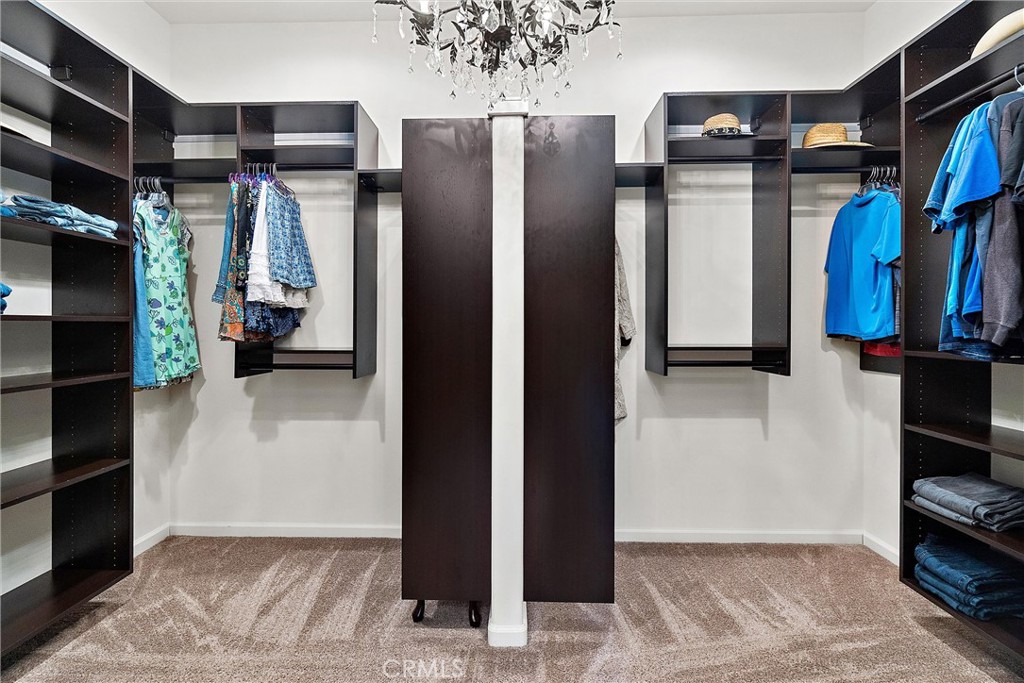 18205 Walnut Avenue Atascadero, CA 93422 - Photo 19 of 46 a view of walk in closet with clothes and shoes