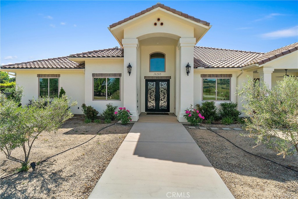 18205 Walnut Avenue Atascadero, CA 93422 - Photo 2 of 46 a front view of a house with yard