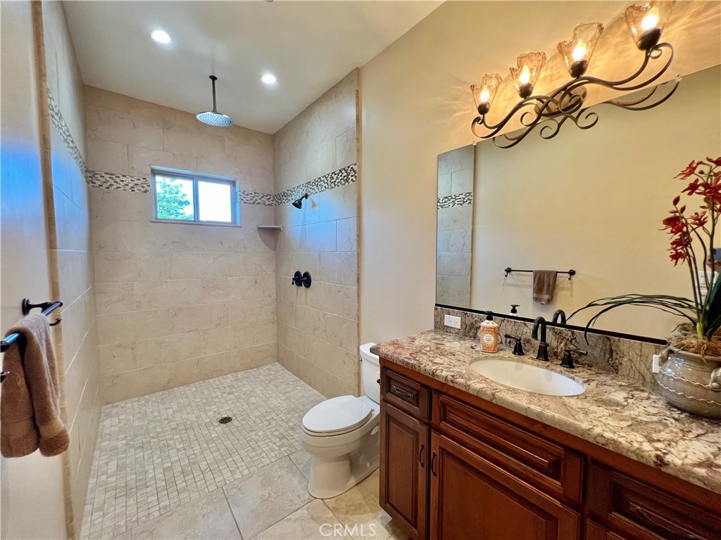 18205 Walnut Avenue Atascadero, CA 93422 - Photo 22 of 46 a bathroom with a sink a toilet and shower