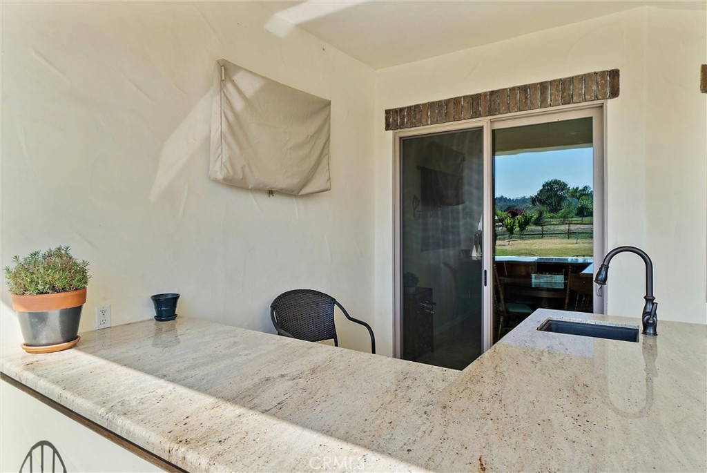 18205 Walnut Avenue Atascadero, CA 93422 - Photo 31 of 46 a bedroom with a bed and a large window