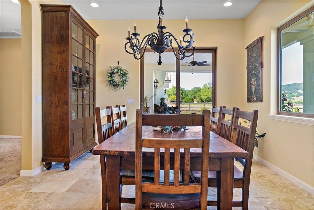 18205 Walnut Avenue Atascadero, CA 93422 - Photo 9 of 46 a view of a dining room with furniture window and wooden floor