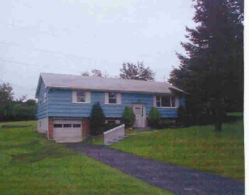 2 Stonecastle Road New Milford, CT 06776 - Photo 1 of 1 a view of a brick house with a yard