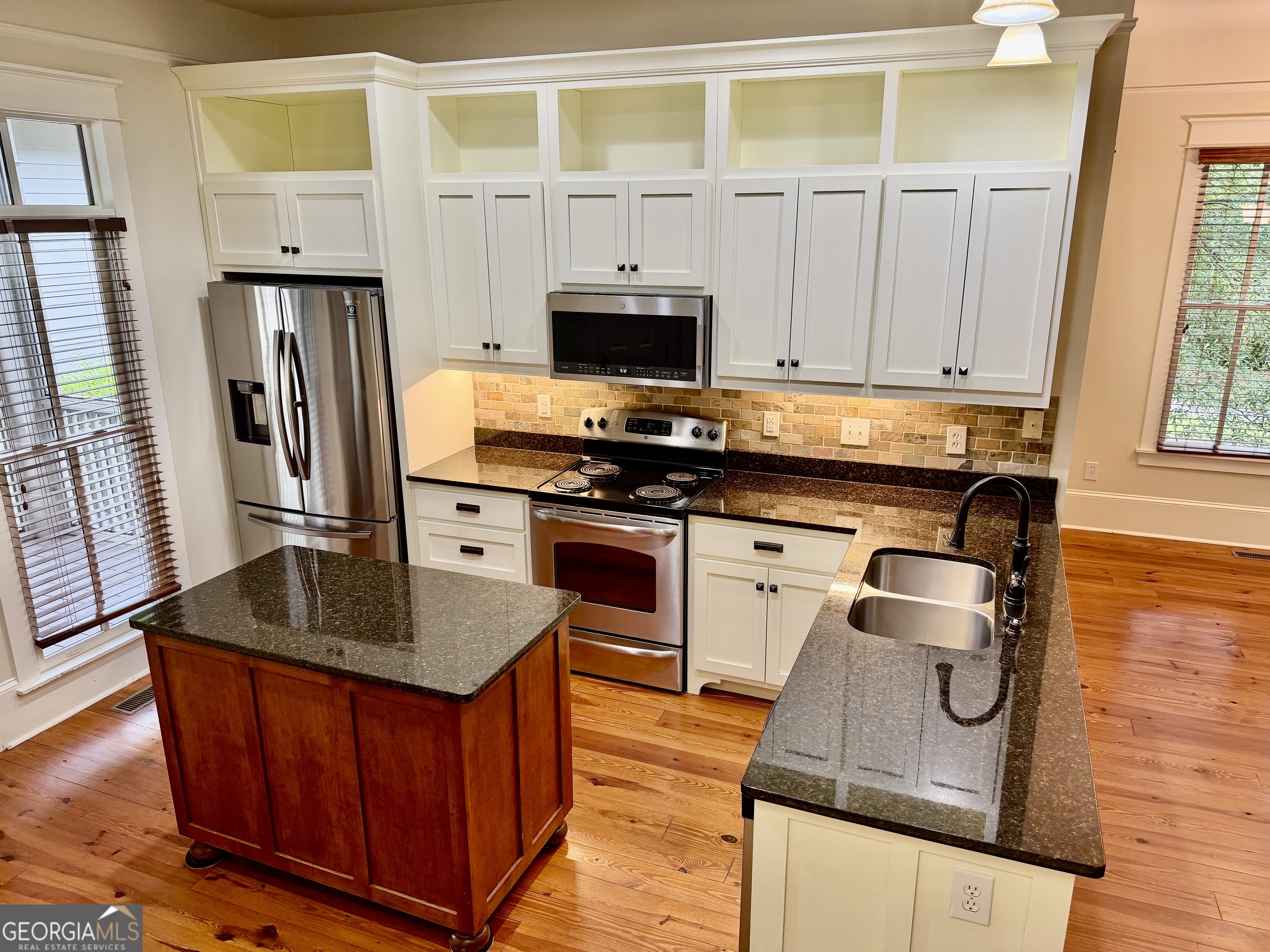 25 Charter Oak Drive Athens, GA 30607 - Photo 10 of 19 a kitchen with stainless steel appliances granite countertop a sink stove and refrigerator