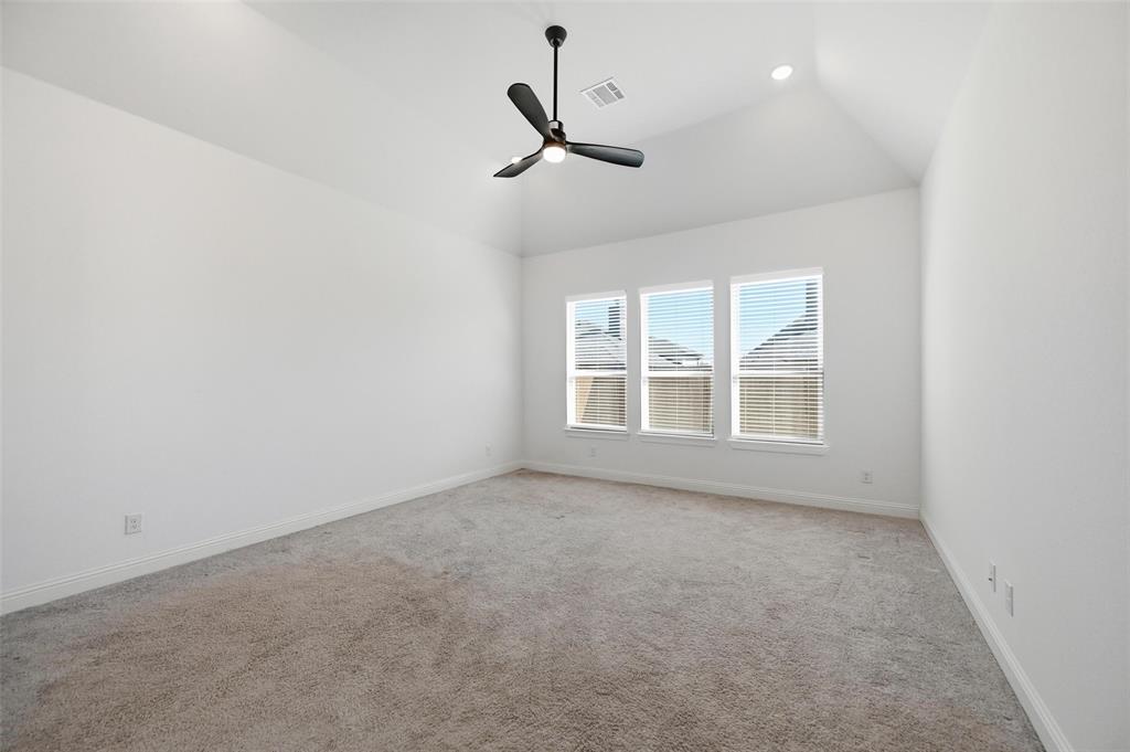 513 Fieldstone Lane Haslet, TX 76052 - Photo 16 of 18 an empty room with a ceiling fan and window