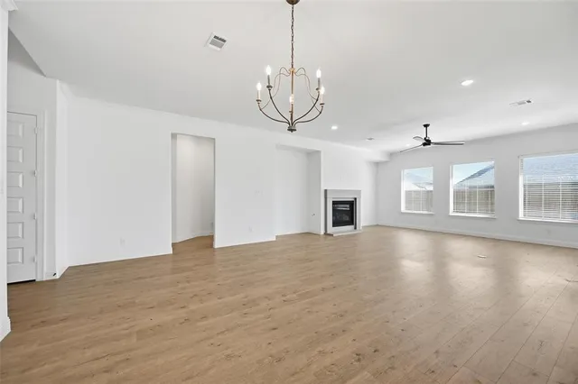 a bathroom with double vanity sinks a mirror and shower