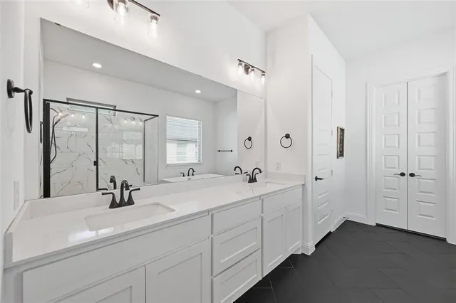 a bathroom with a tub and shower