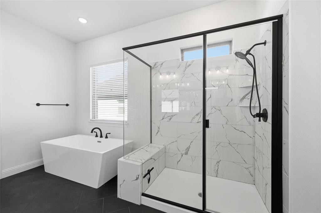 513 Fieldstone Lane Haslet, TX 76052 - Photo 7 of 18 a bathroom with a tub and shower