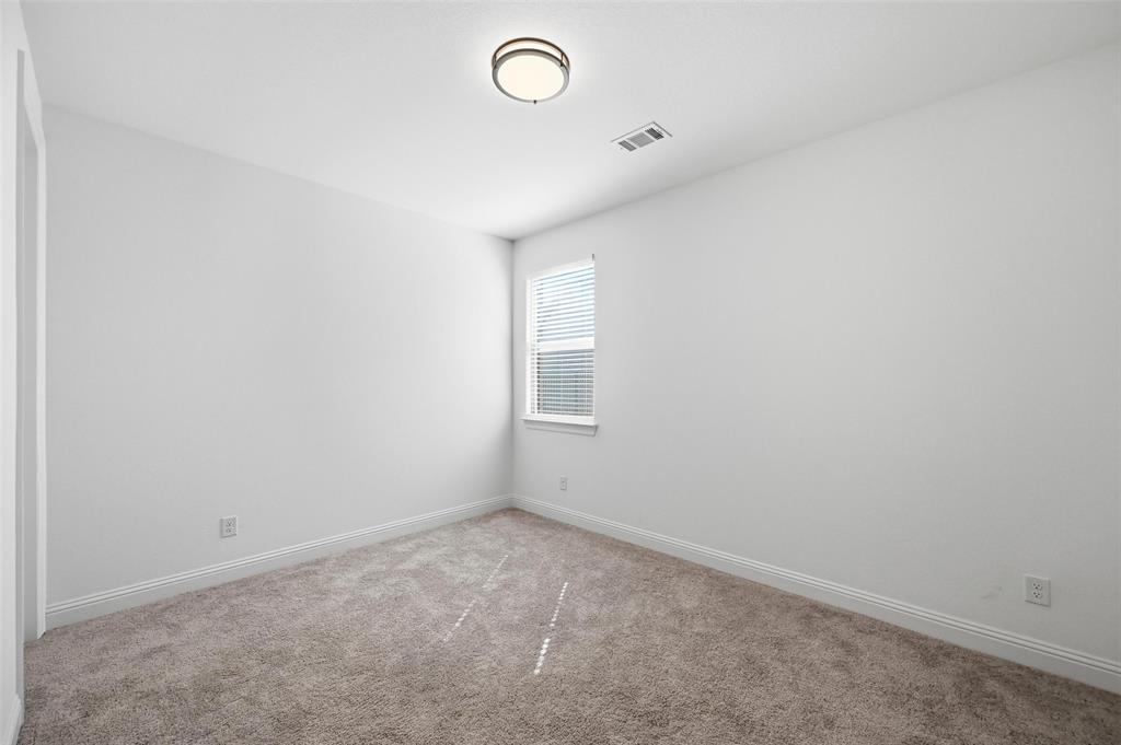 513 Fieldstone Lane Haslet, TX 76052 - Photo 8 of 18 an empty room with a window