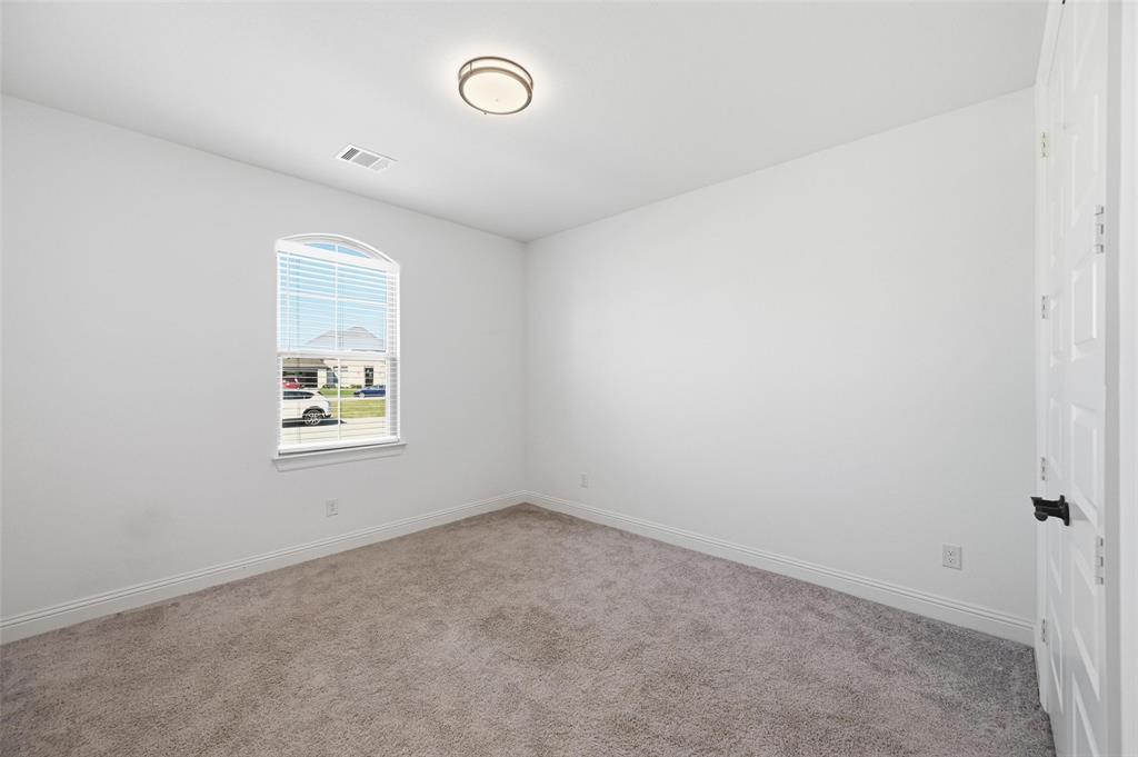 513 Fieldstone Lane Haslet, TX 76052 - Photo 10 of 18 an empty room with windows