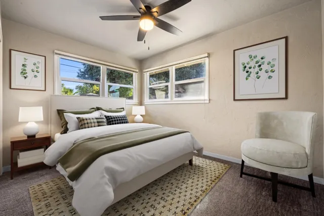 a bedroom with bed and a window