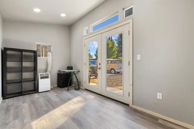 a view of an empty room with glass door