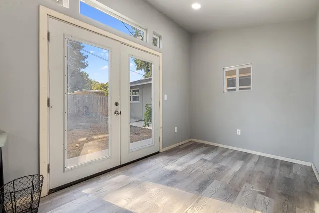 a view of a wooden door with an outdoor space