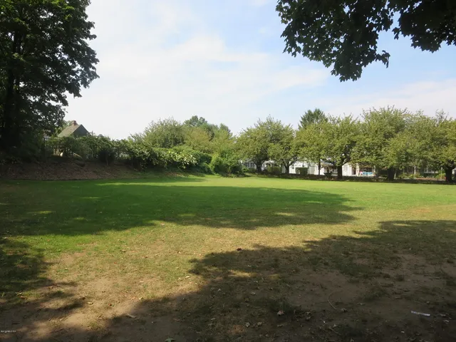 a view of a golf course with a lake