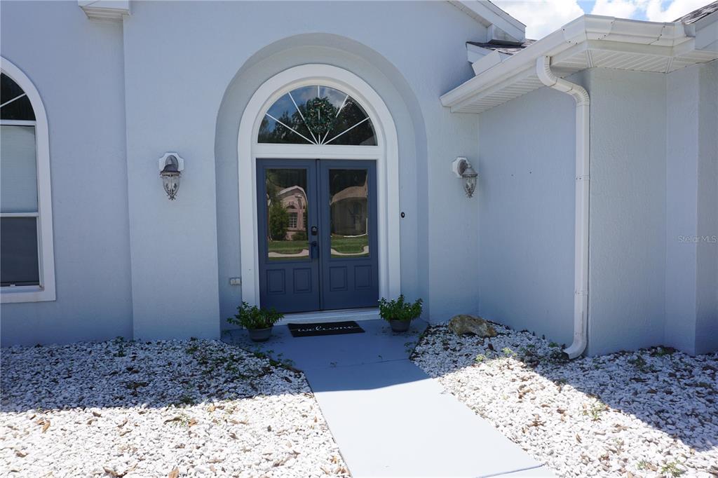 6722 Southwest 111th Loop Ocala, FL 34476 - Photo 3 of 51 DOUBLE DOOR GLASS ENTRY