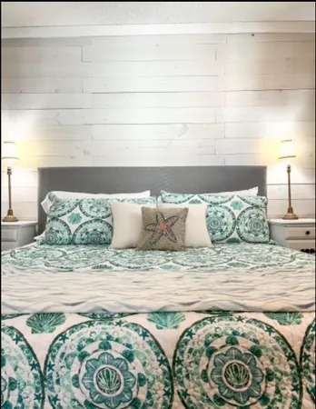 a view of a bedroom with a bed