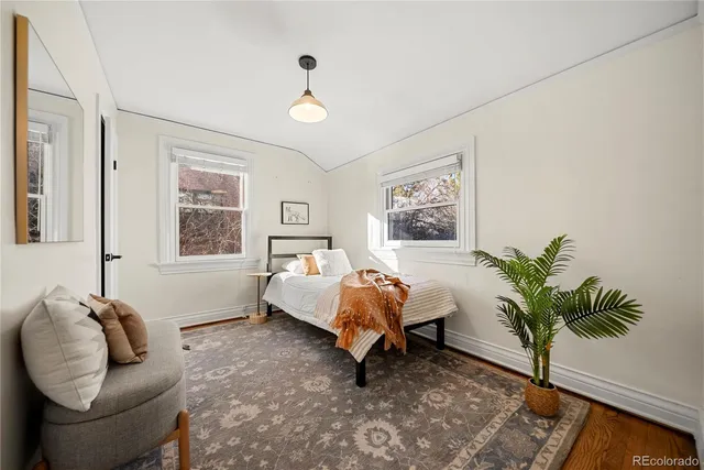 a bed room with a bed and a window