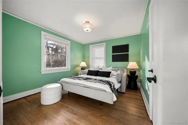 a bedroom with bed and a window