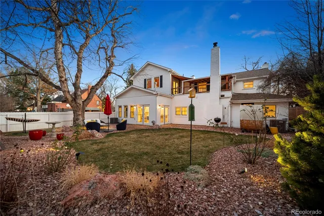 a front view of a house with large garden