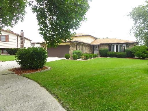 625 Wolf Road Matteson, IL 60443 - Photo 1 of 15 a front view of house with yard and green space