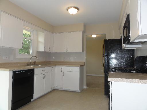 625 Wolf Road Matteson, IL 60443 - Photo 3 of 15 a kitchen with stainless steel appliances granite countertop a sink a stove and a refrigerator