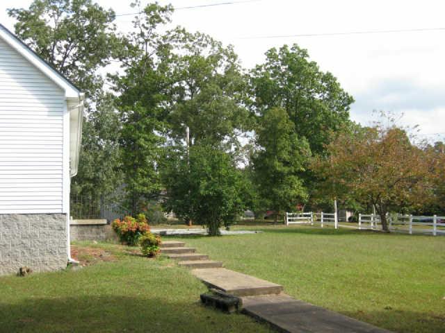 950 Woodhaven Road Lyles, TN 37098 - Photo 20 of 20 View of front yard from the paved driveway on the North side of home. You'll never have to get your shoes muddy to enter this house!