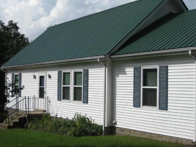 950 Woodhaven Road Lyles, TN 37098 - Photo 2 of 20 Vinyl siding and a metal roof make maintenance a breeze!
