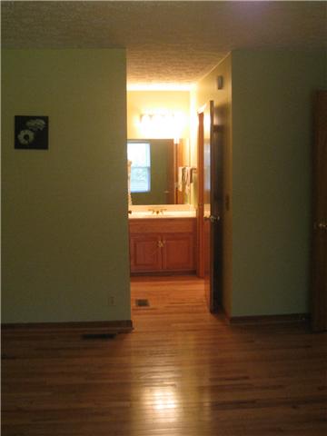 950 Woodhaven Road Lyles, TN 37098 - Photo 9 of 20 The Master closet is a large walk-in with wood floors as well and has a Separate vanity with single sink in the master dressing area adjacent to a full bathroom.