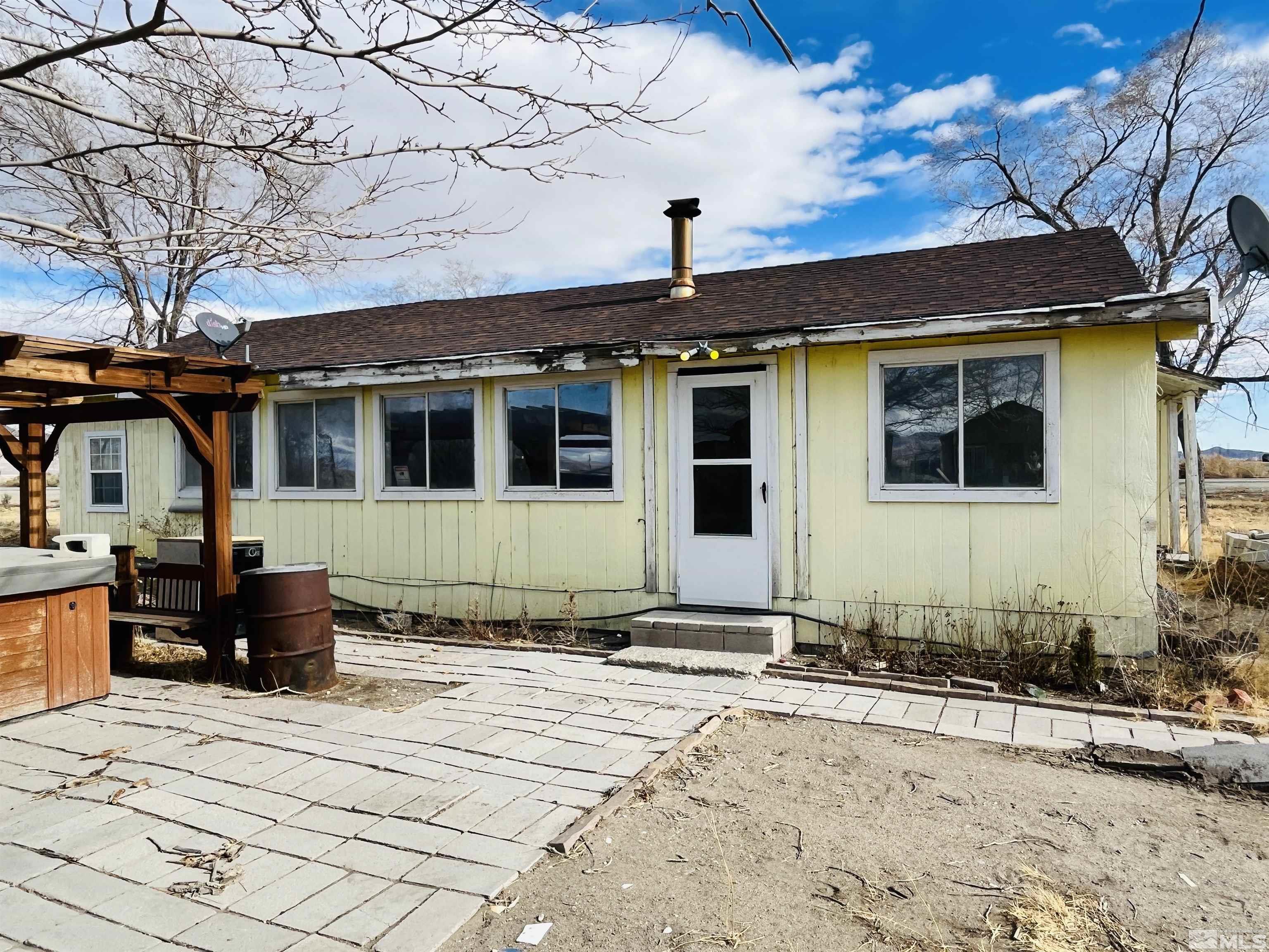 249 Us Highway 95a North Yerington, NV 89447 - Photo 2 of 24 a front view of a house with a yard
