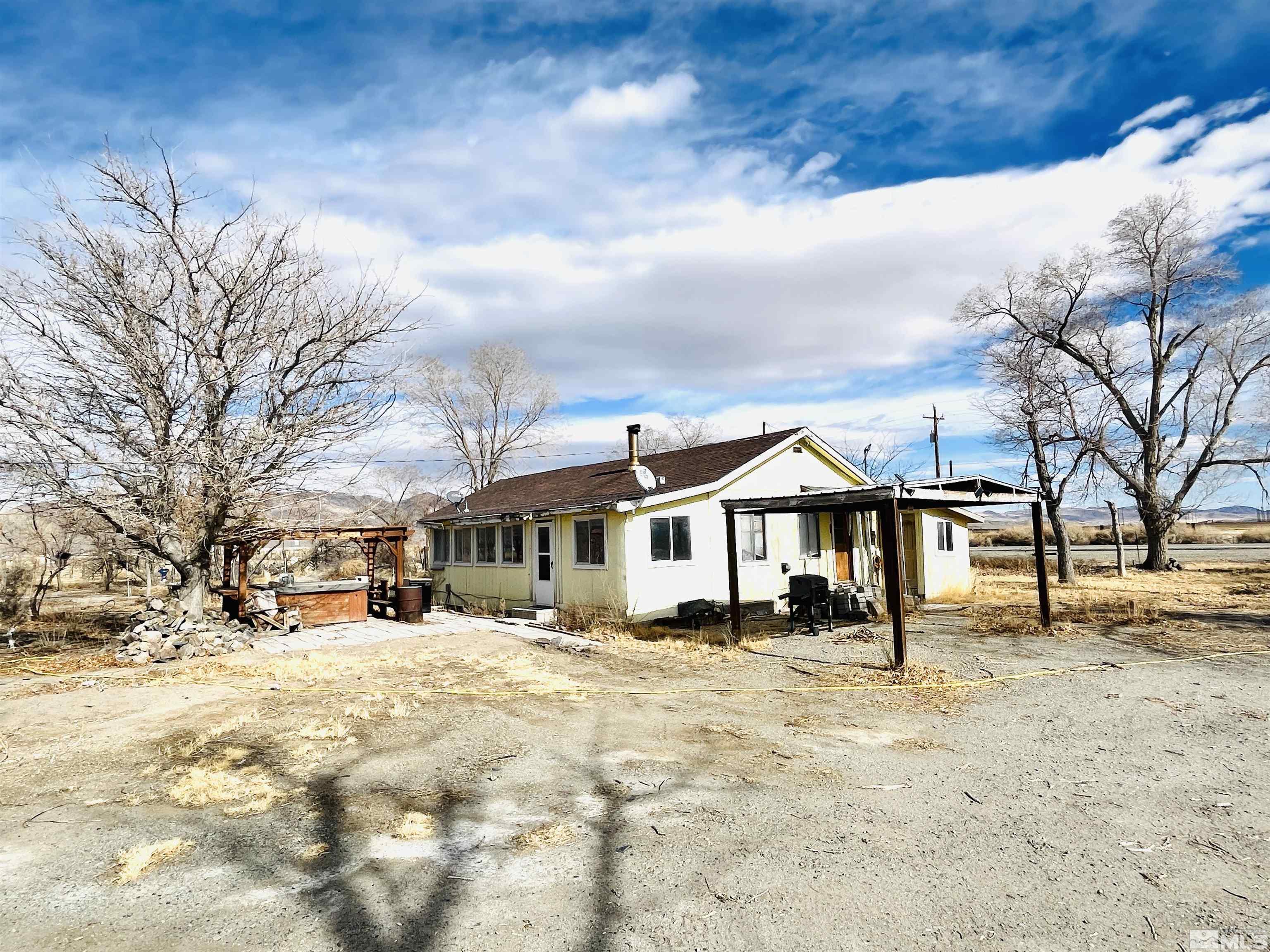 249 Us Highway 95a North Yerington, NV 89447 - Photo 21 of 24 a front view of a building with large trees