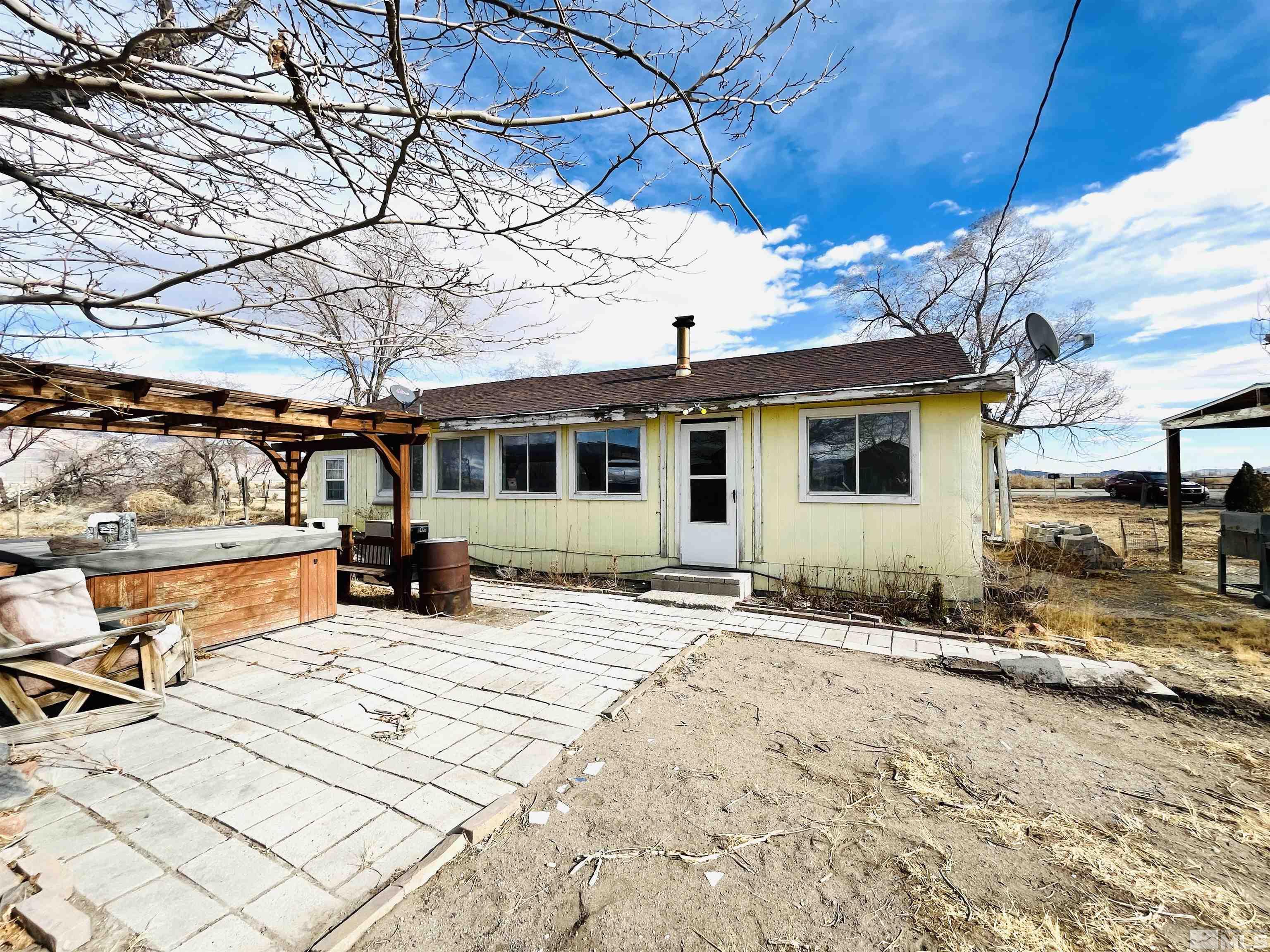 249 Us Highway 95a North Yerington, NV 89447 - Photo 3 of 24 a view of a house with wooden fence