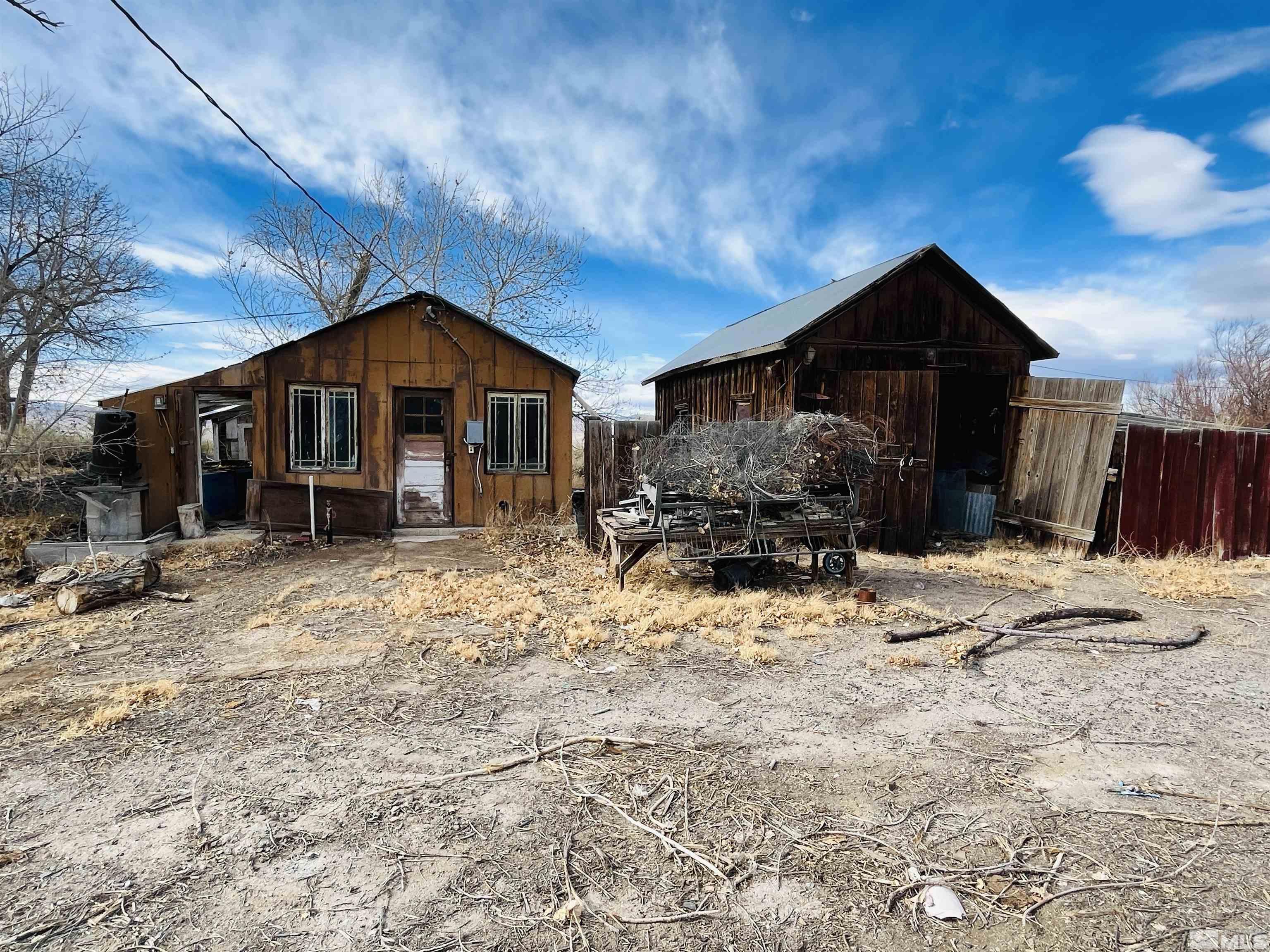 249 Us Highway 95a North Yerington, NV 89447 - Photo 9 of 24 a view of a house with a yard covered in snow