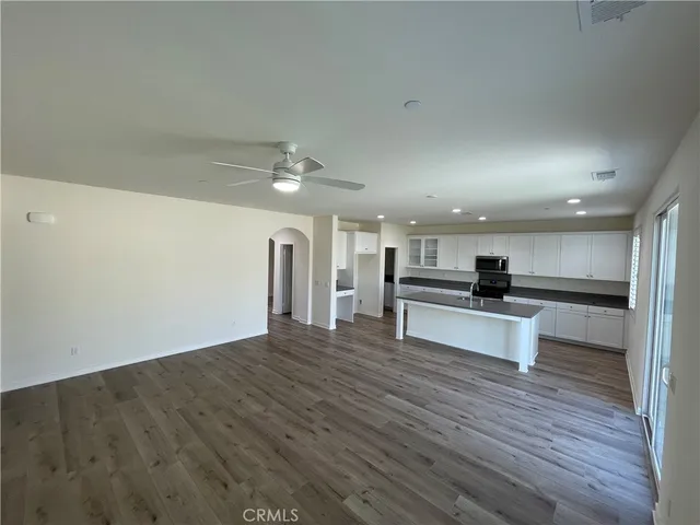 a view of kitchen with microwave and stove