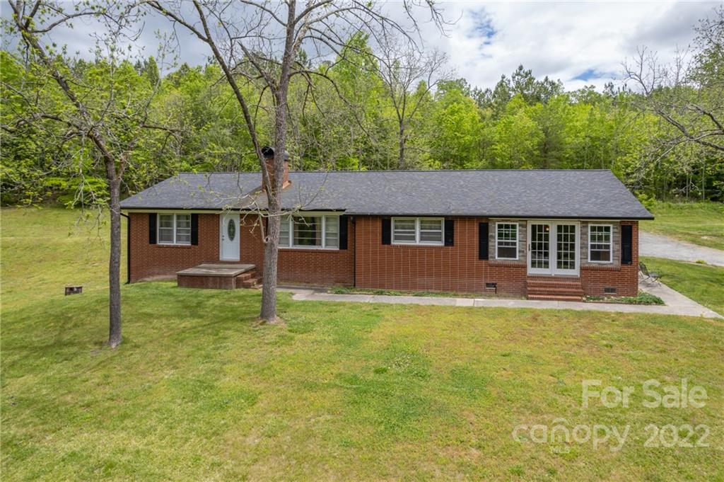 488 Elliott Road Rutherfordton, NC 28139 - Photo 1 of 44 a house that has a tree in it