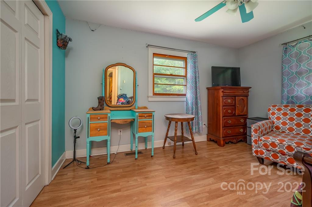 488 Elliott Road Rutherfordton, NC 28139 - Photo 18 of 44 a living room filled with furniture and a wooden floor