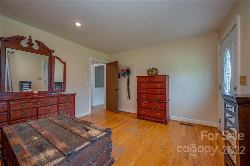 488 Elliott Road Rutherfordton, NC 28139 - Photo 22 of 44 a bedroom with a bed and a dresser