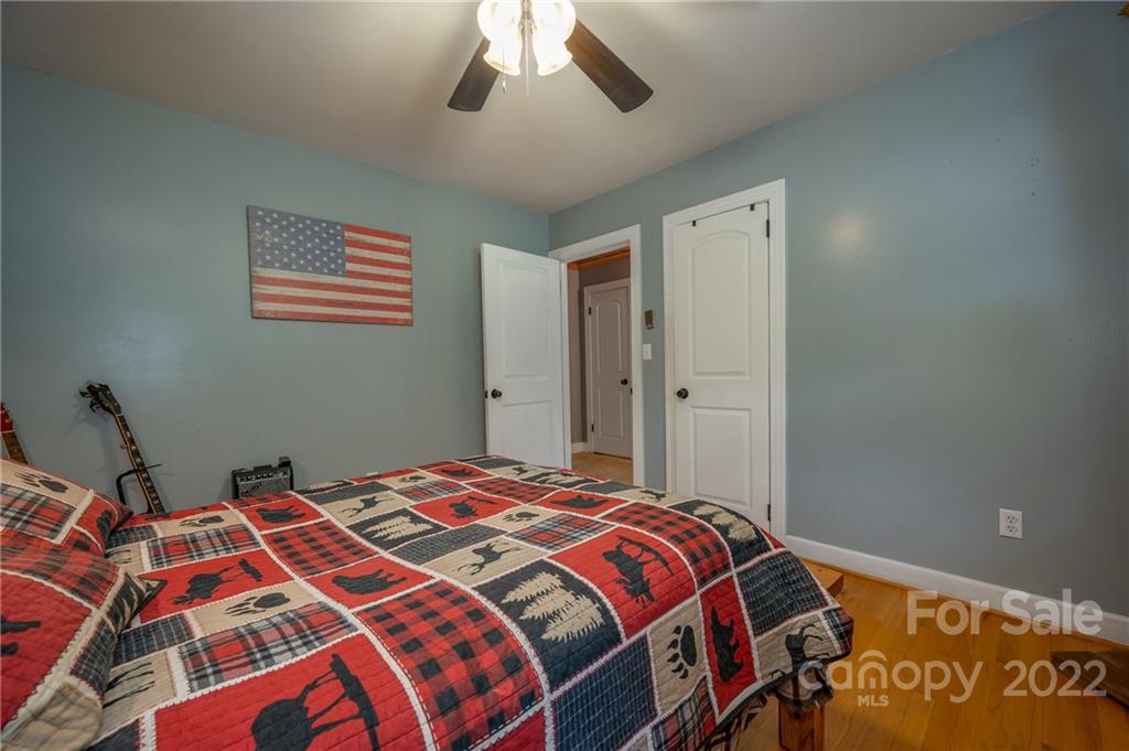 488 Elliott Road Rutherfordton, NC 28139 - Photo 24 of 44 a bedroom with a bed and a book shelf
