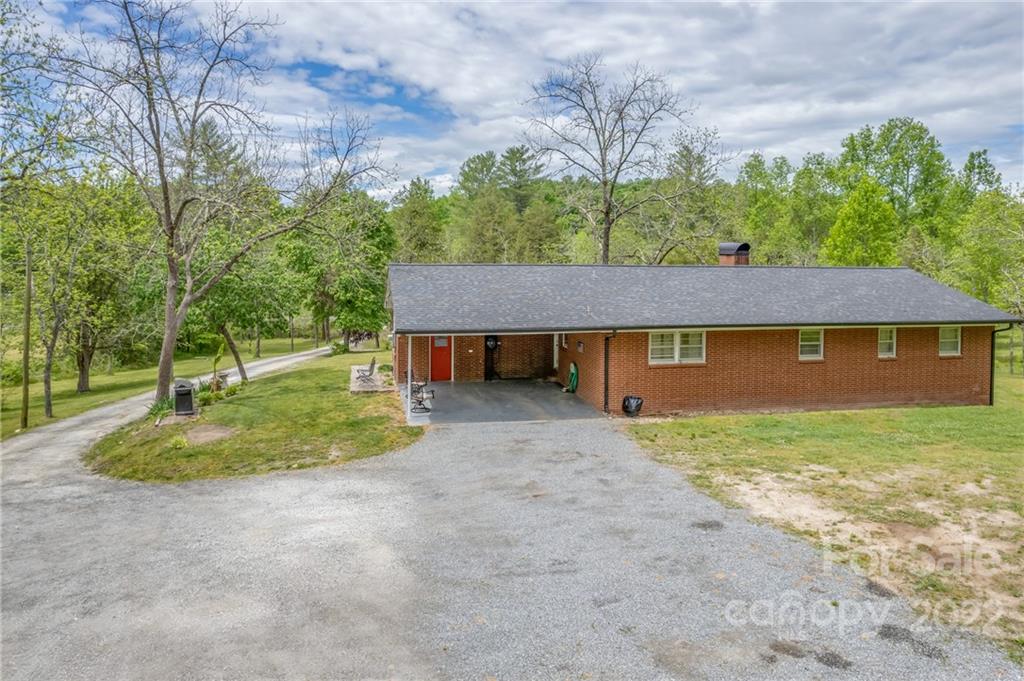 488 Elliott Road Rutherfordton, NC 28139 - Photo 3 of 44 a front view of a house with a yard and garage