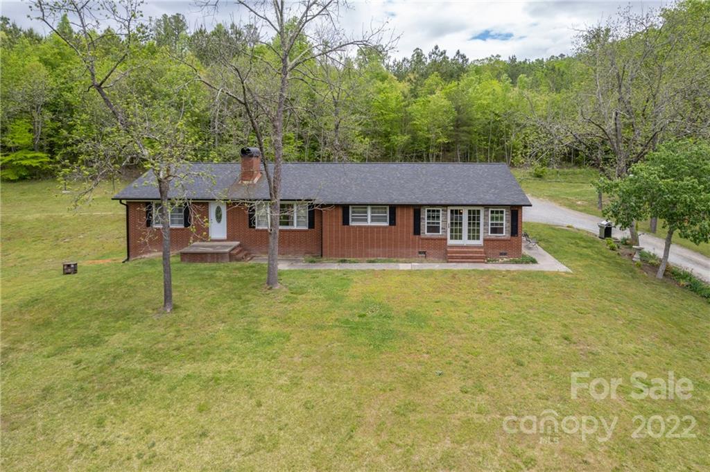 488 Elliott Road Rutherfordton, NC 28139 - Photo 44 of 44 a aerial view of a house with swimming pool next to a yard