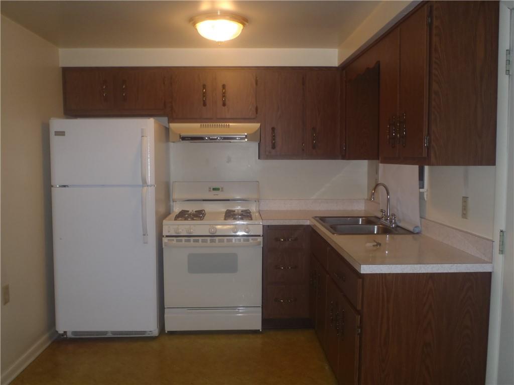 401 Industry Road Buena Vista, PA 15018 - Photo 4 of 12 a kitchen with a sink a stove and refrigerator