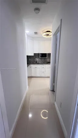 a bathroom with a sink toilet and mirror