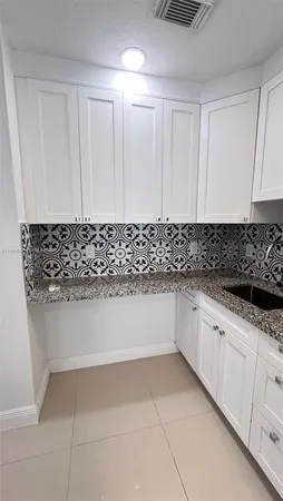 a bathroom with a bathtub and sink