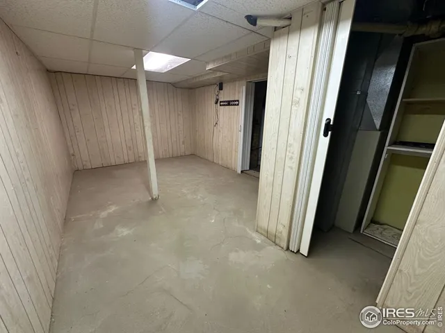 an empty room with a fireplace