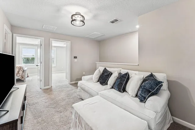 a bed room with a bed and a television