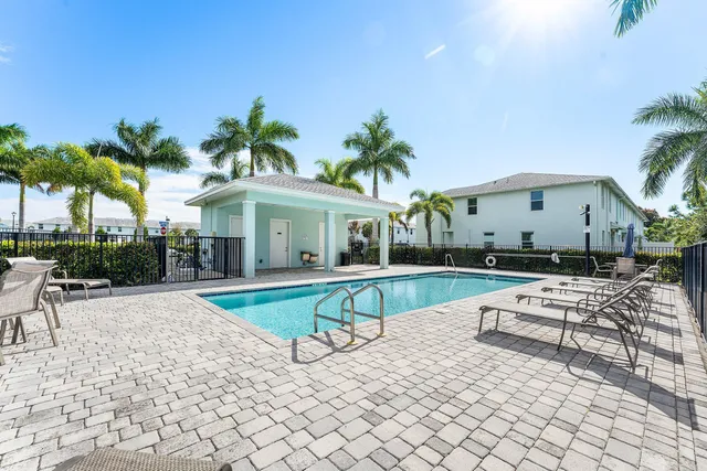 a view of a house with backyard porch and sitting area