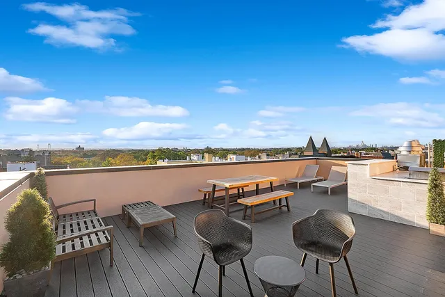 a view of a chairs and table in patio