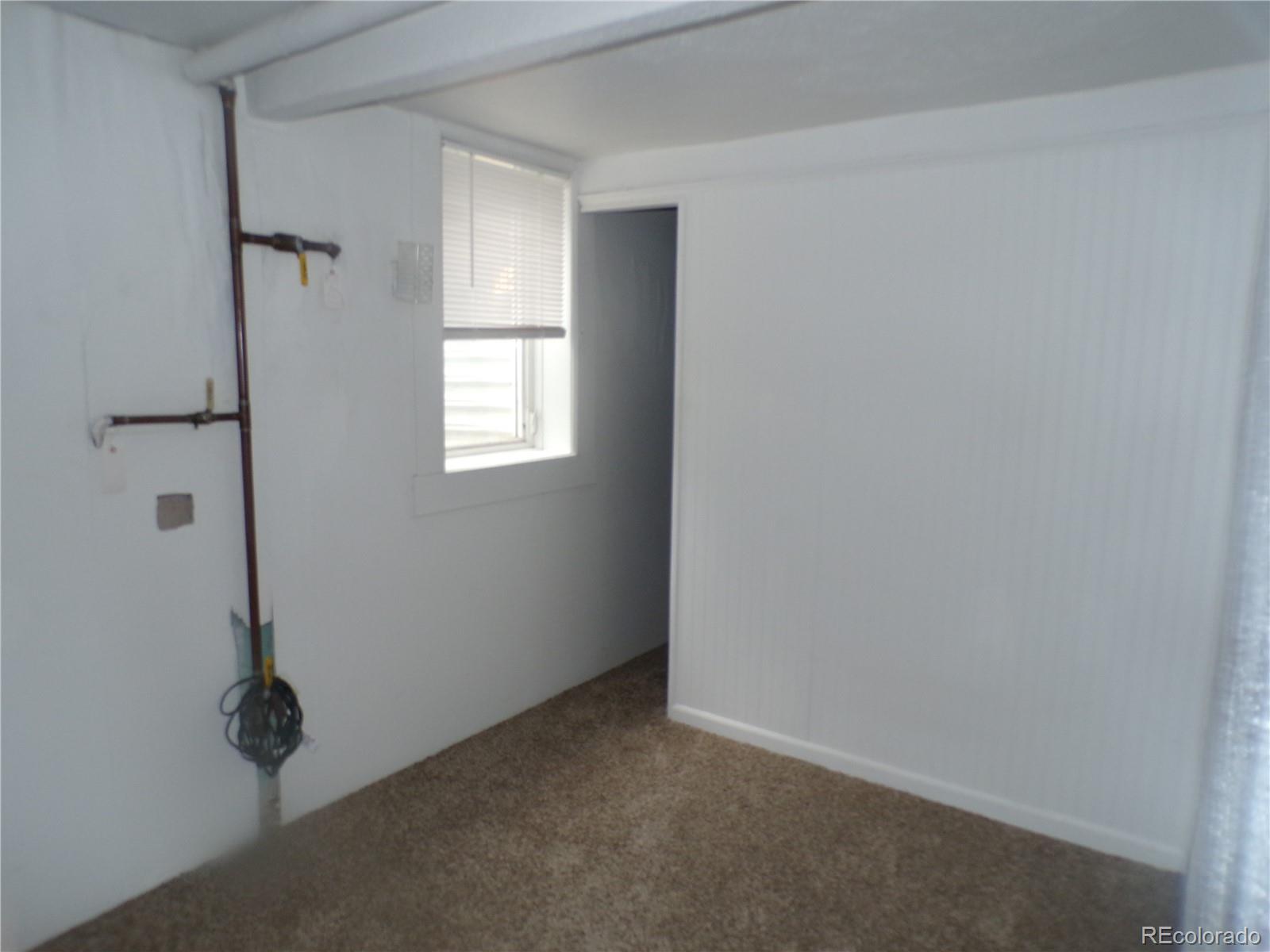 644 North Marion Street Denver, CO 80218 - Photo 13 of 19 an empty room with windows