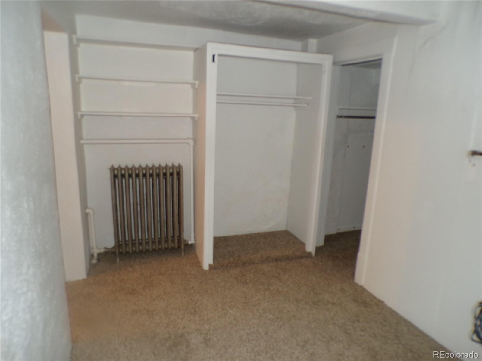 644 North Marion Street Denver, CO 80218 - Photo 14 of 19 an empty room with a door