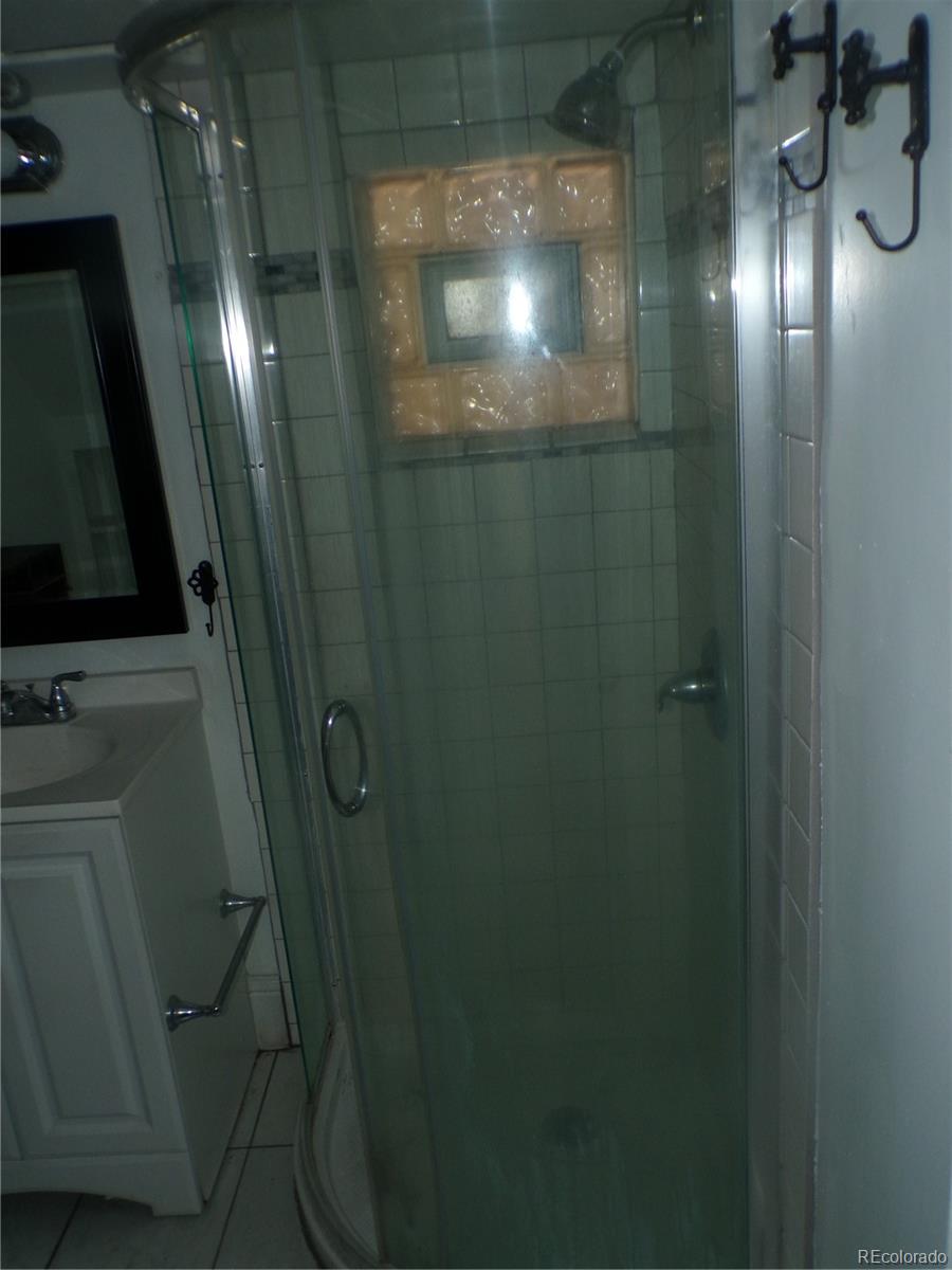 644 North Marion Street Denver, CO 80218 - Photo 9 of 19 a bathroom with a mirror