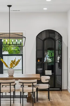 a kitchen with a sink a counter space and cabinets